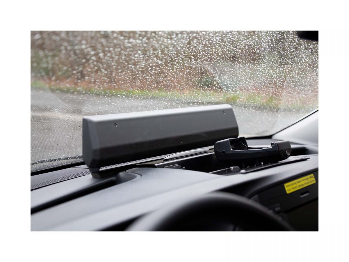 DD-100 Dashboard Display In Situ on Vehicle Dash Interior Rear Shot Against Rainy Window