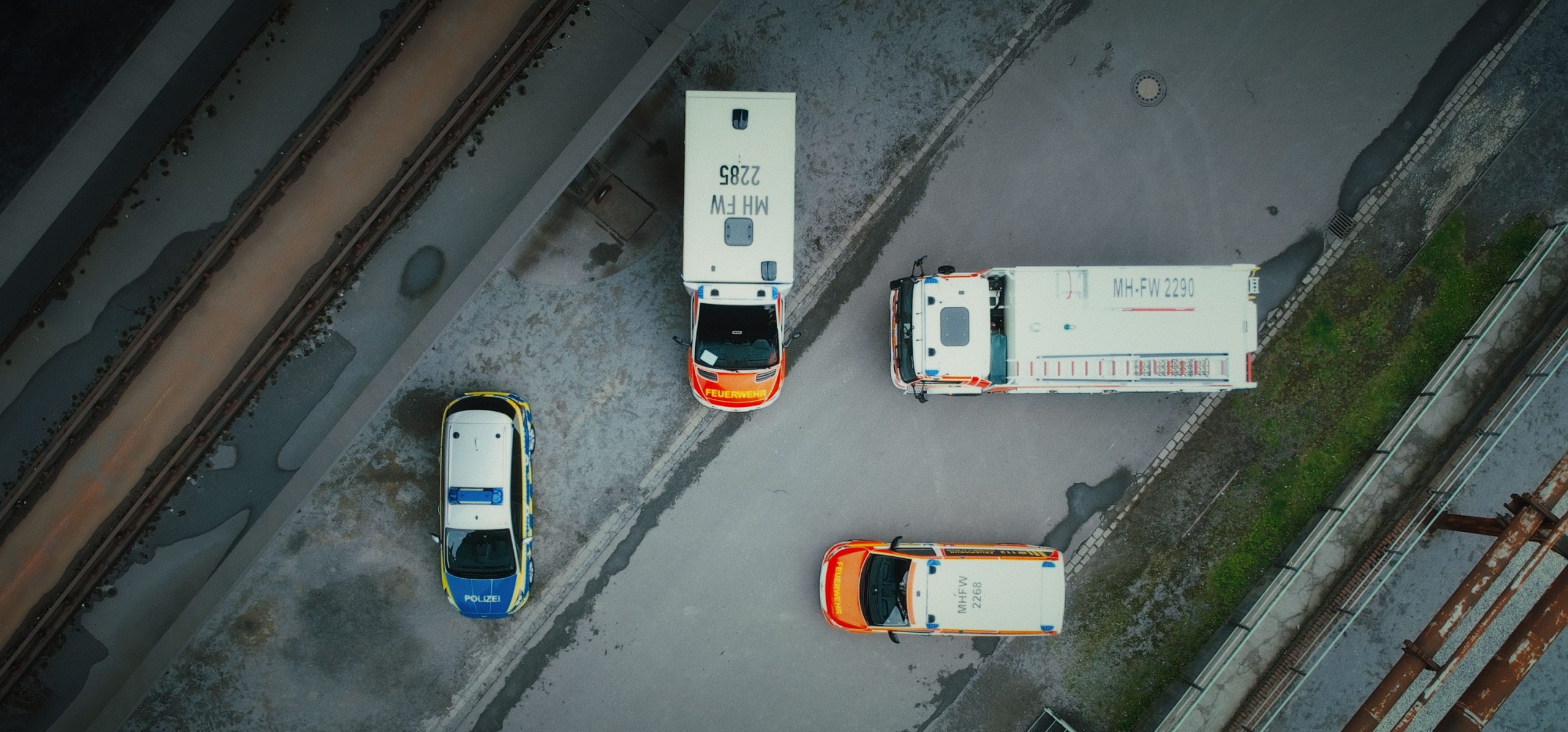 Hero Image Aerial Emergency Vehicles all Parked on concrete in different directions at 90 degrees to one another