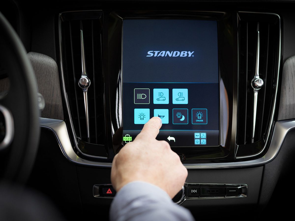Center Stack Display Switch Graphical User Interface In Situ on Volvo Infotainment System with Finger Pressing Horn Button
