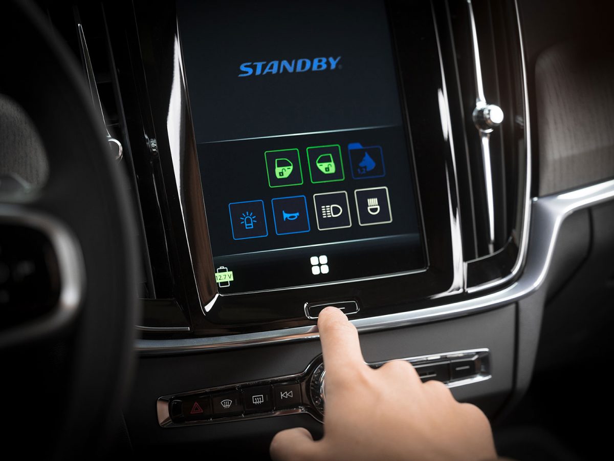 Center Stack Display Switch Graphical User Interface In Situ on Volvo Infotainment System with Finger Pressing Home Button