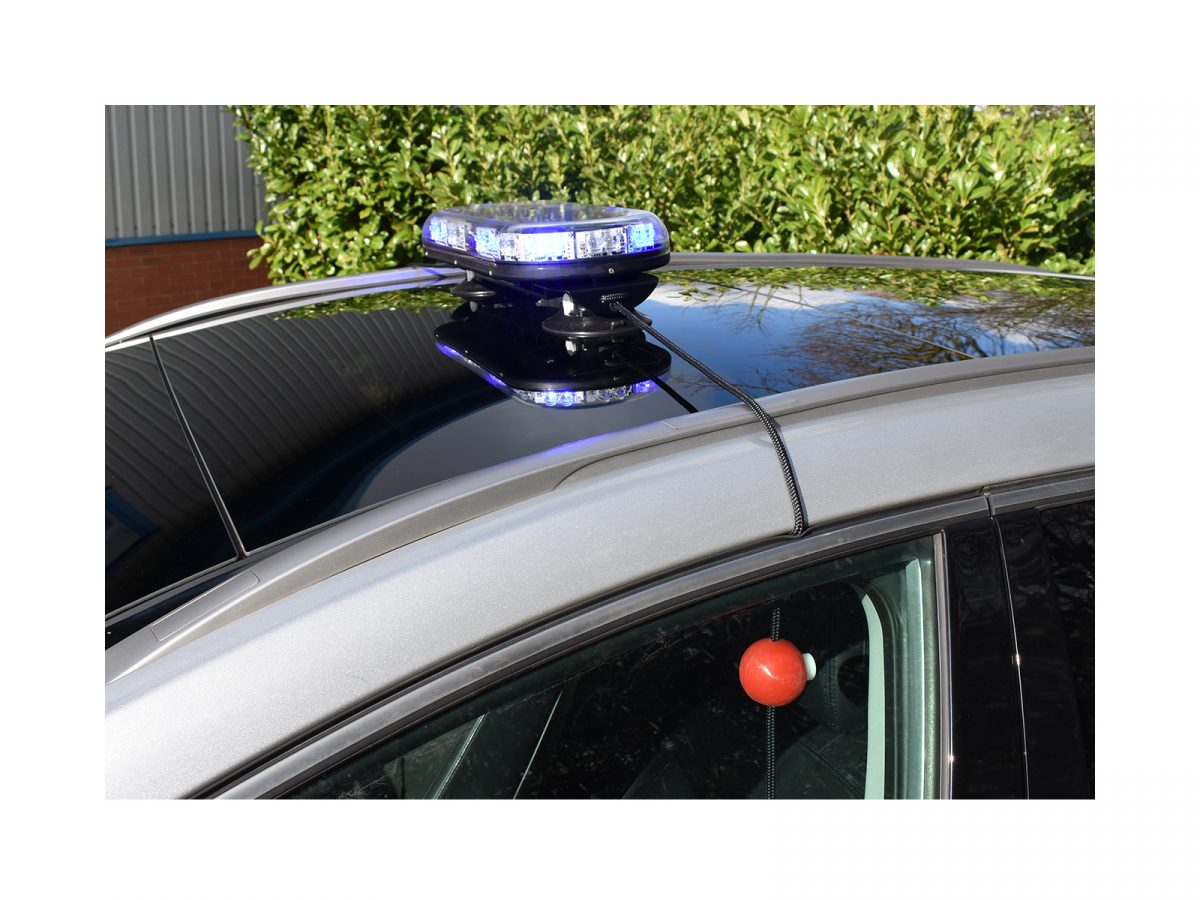 Trail Blazer 2 LED Mini Lightbar Clear Angle View Blue White Lit In Situ on Black Car Roof 2