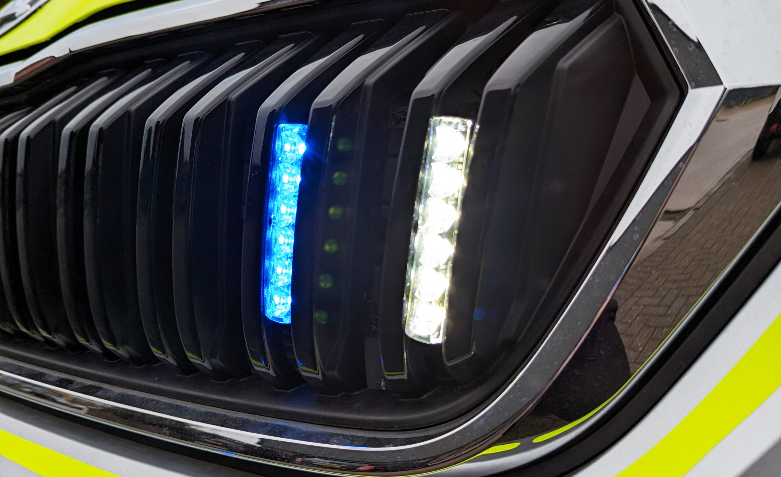 Closely Cropped Shot of Blue and White Grille Lights