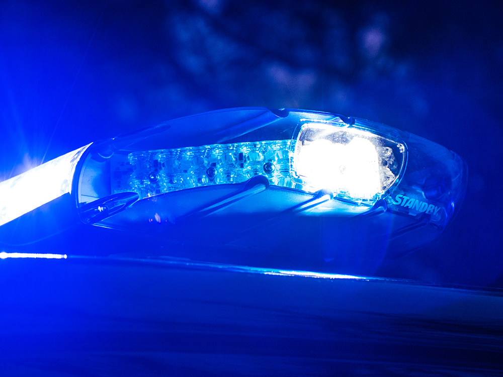 Closely cropped image of the W3 lightbar on top of a vehicle at night with white lights on