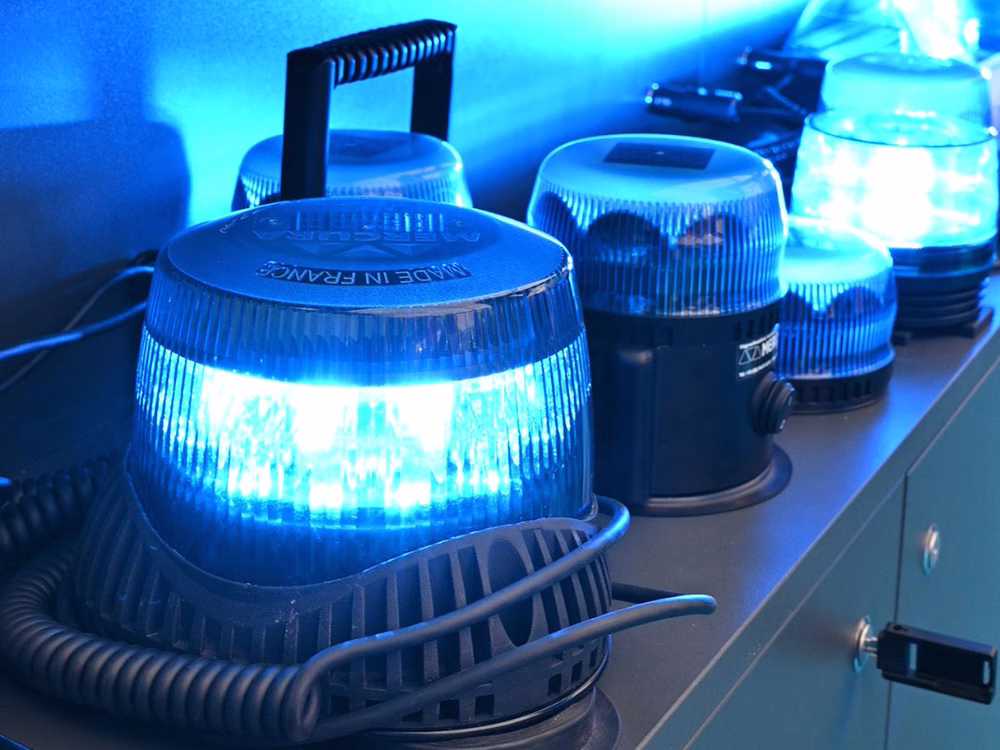Blue Standby beacons lit up on a stand shelf.