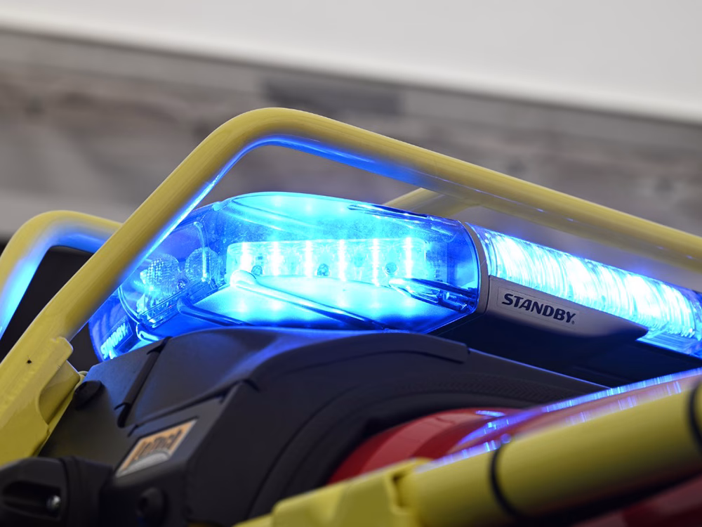 Closley cropped photo of the end of a blue Standby W3 Lightbar on top of an emergency appliance.