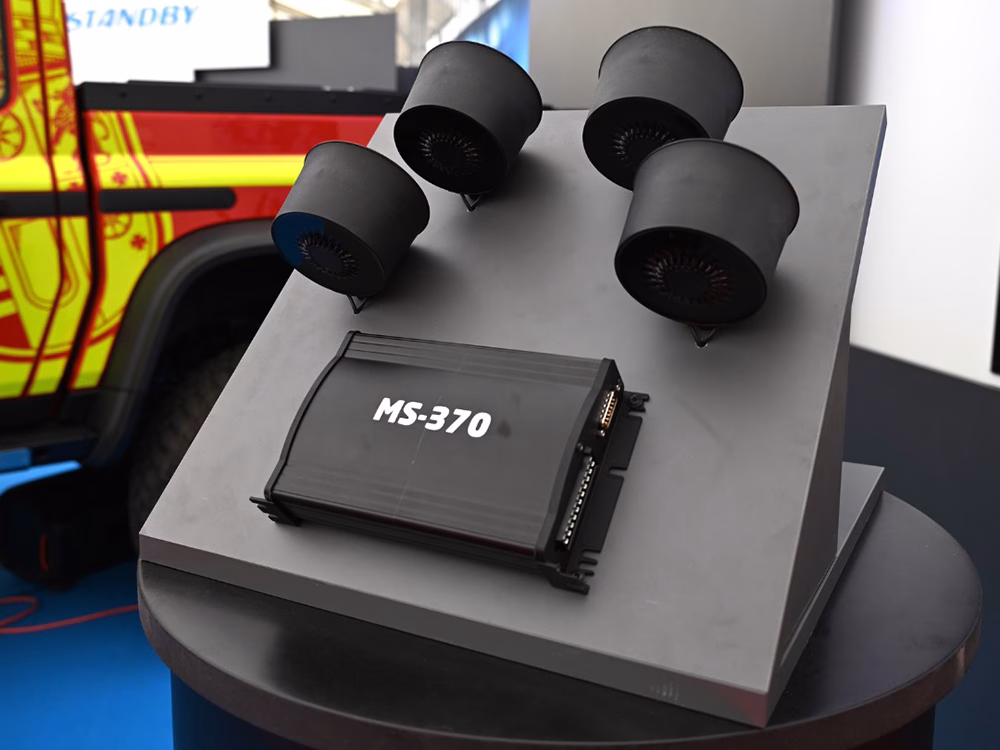 MS-370 Unit and Speakers on a black display panel on the Standby Group stand.
