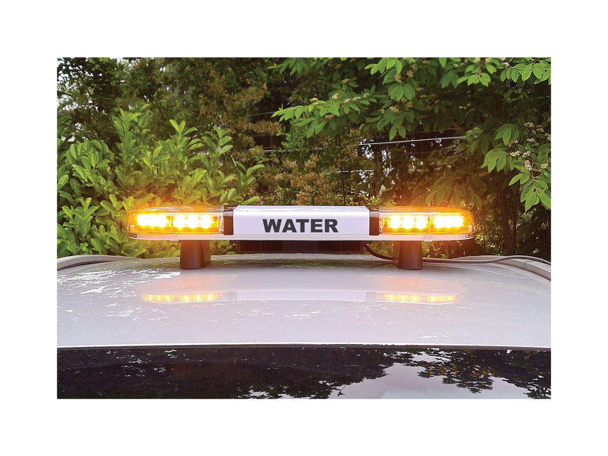 Hurricane PA Lightbar with 60 Watt Speaker Driver In Situ Front View Lit Water Livery on Roof of Silver Car Close Up