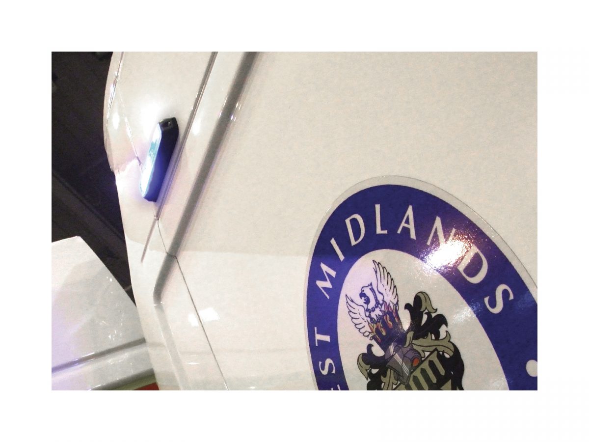 Mini Stealth - 6-way Horizontal Surface Mount LED Modules Mounted on Exterior of Police Car above West Midlands Police Shield Decal