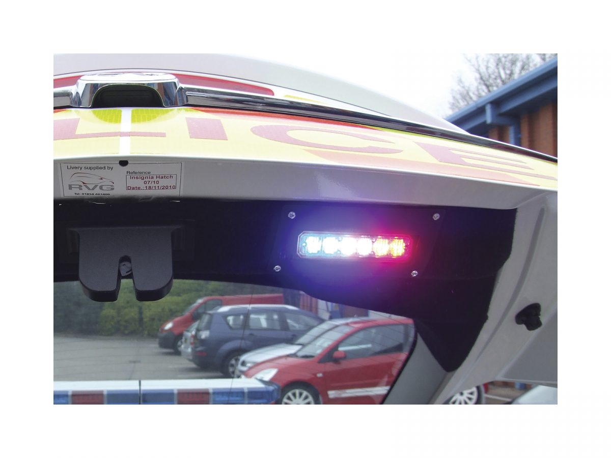 Mini Stealth - 6-way Horizontal Surface Mount LED Modules Mounted On Police Car Boot Illuminated Blue and Red
