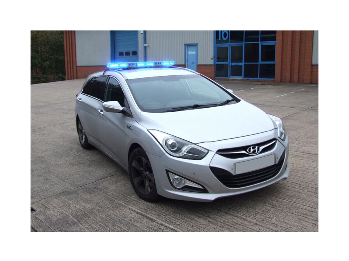 Aegis LED Lightbar In Situ Lit Blue on top of Silver Car Roof Angle View