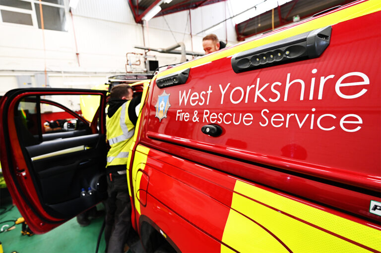 West Yorkshire Fire Appliance with AutoEye Xpert Pro Products Being Installed in Workshop Two Installers Working on Vehicle