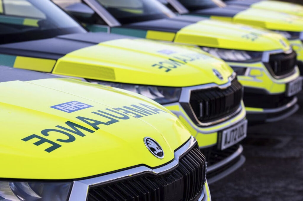Closeup of row of Skoda Kodiaq Response Vehicles Parked at an Angle with NHS Ambulance Livery Grille Lights are Off