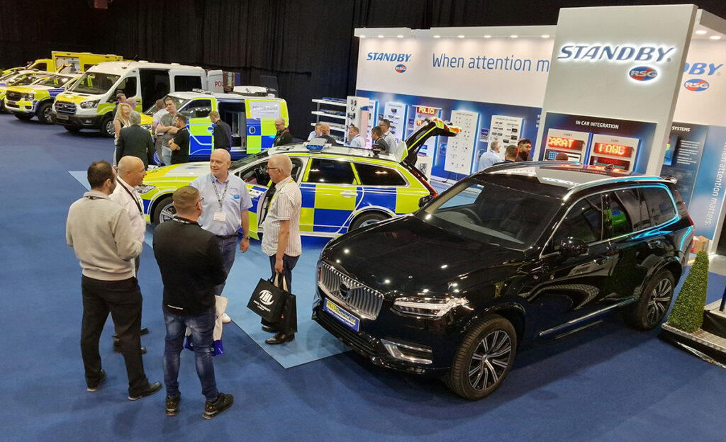 NAPFM Standby Stand Upward Angle View Showing Various Groups of People on the Stand, a Police Car, Black Armoured Car and Police Van