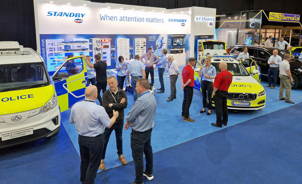 NAPFM Standby Stand Upward Angle View Showing Various Groups of People on the Stand, a Police Car and Police Van