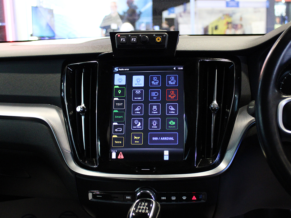 Close up car interior shot of Volvo infotainment system with CARAT interface.