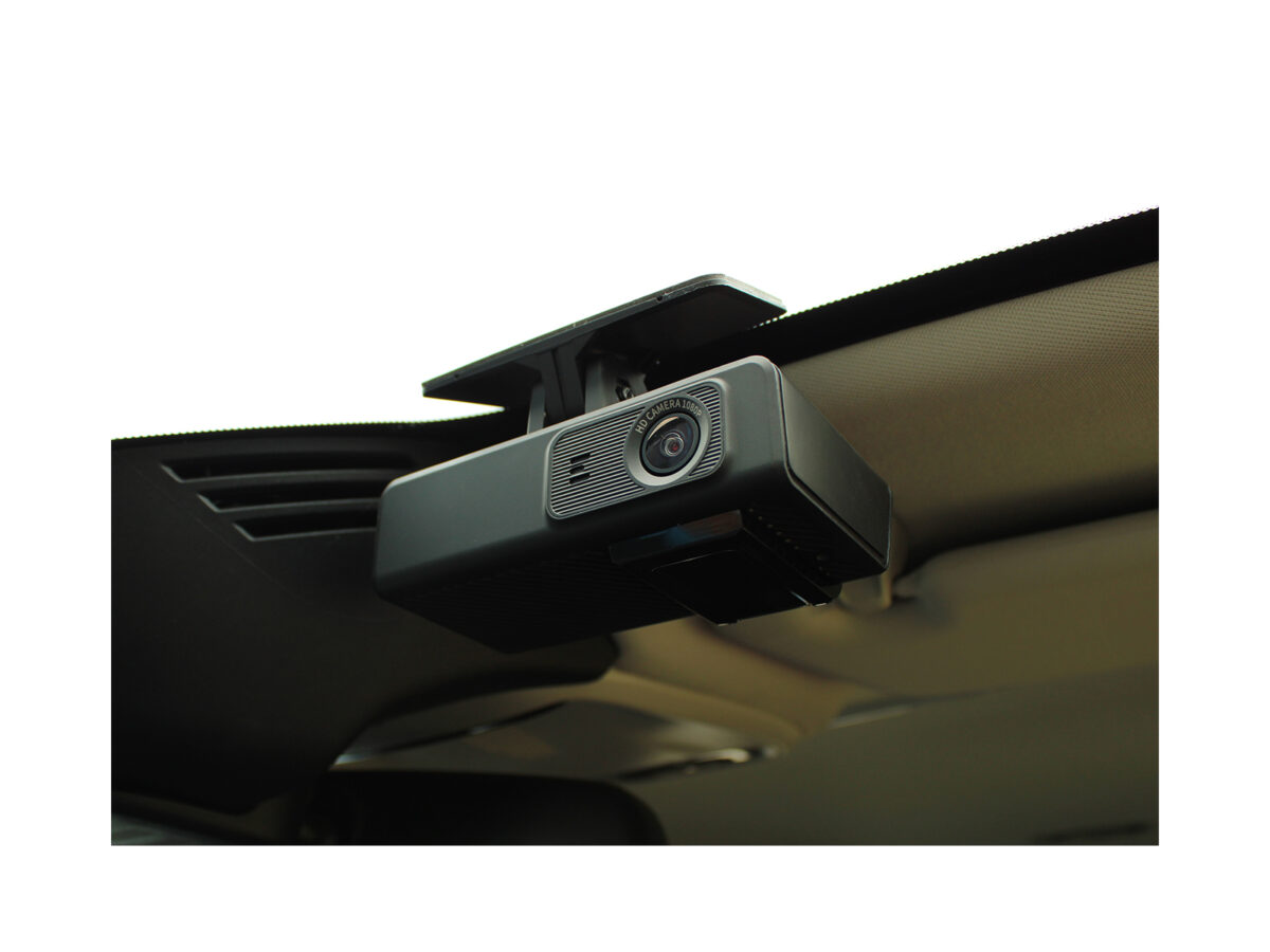 Angle view of the Mini Dashcam mounted on a car windscreen, closely cropped and taken from the car dash.