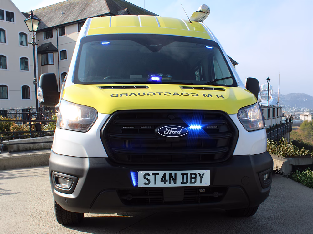 Front view of a HM Coastguard Ford Transit OSV showing various Standby UK blue LED Warning Lights