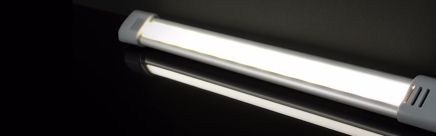 L98 Strip Light shown lit on a glossy black surface