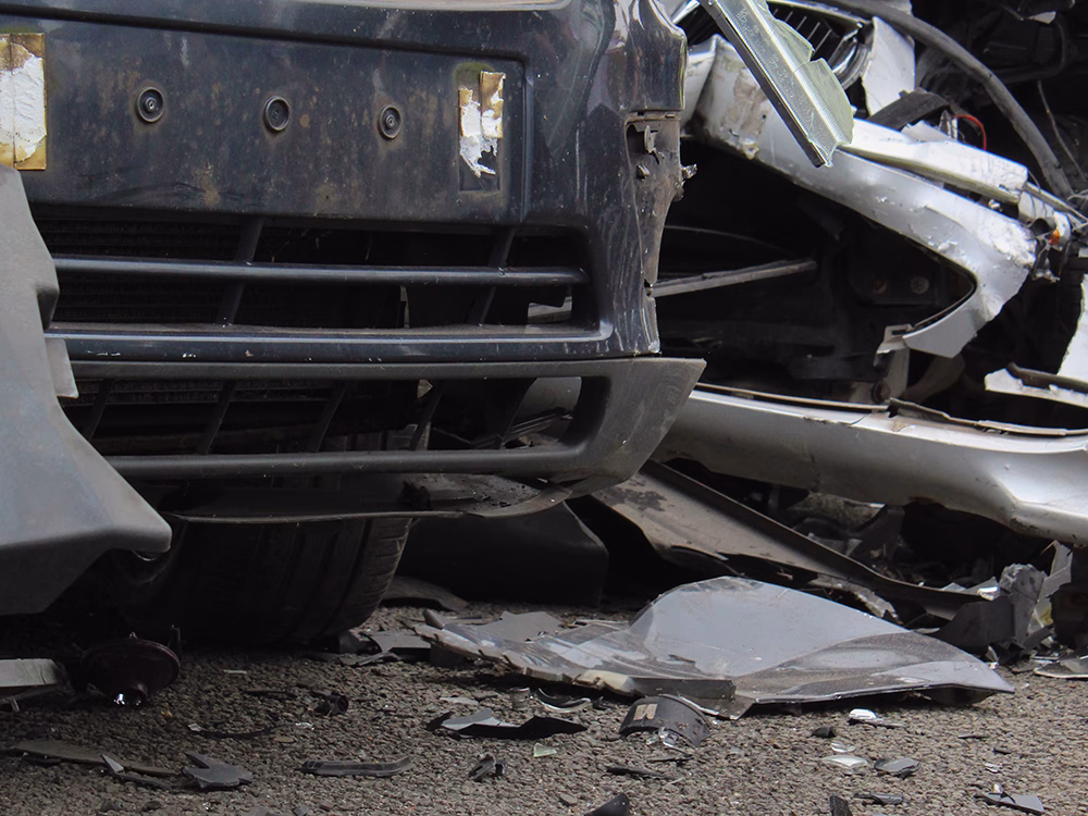 Close up of vehicle damage and debris at ITAI Crash Day 2026