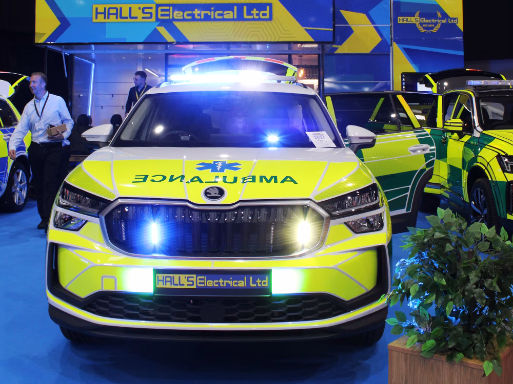 Skoda Kodiak Rapid Response Vehicle shown on the Hall's Electrical stand at NAPFM 2026, featuring Standby equipment with emergency lighting activated.