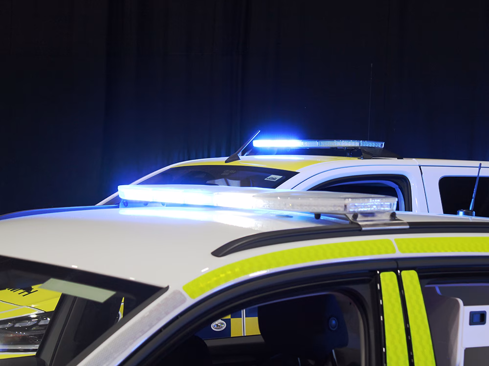 Close up of Raiden lightbars on Hall's Electrical Skoda Kodiak Rapid Response Vehicle and EVO Coastguard Toyota Proace Verso EV Personnel Carrier in front of a black curtain at NAPFM 2026.