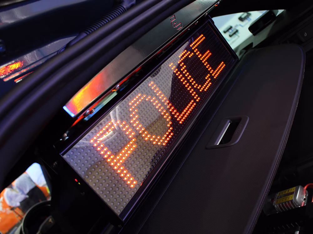 Close up angle shot of the Traffic Commander LED Matrix diplay of a South Wales Police Cupra Leon Estate RPU converted by Elite Solutions at NAPFM 2026.